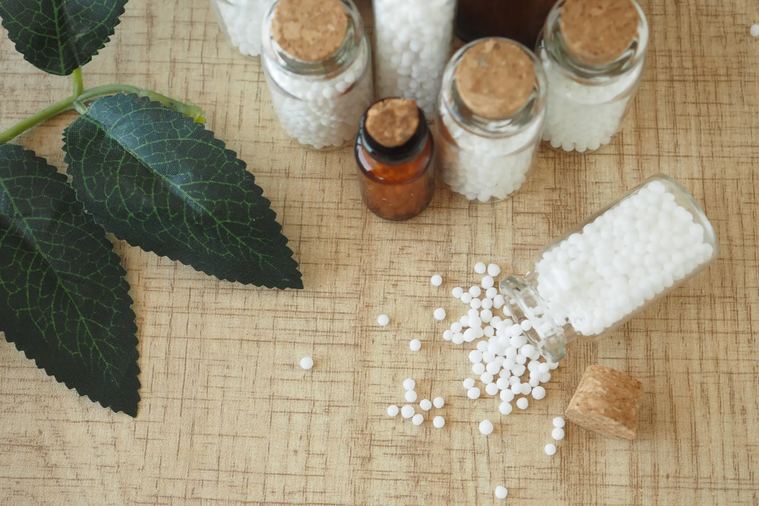 Homeopathic pills containers on a table